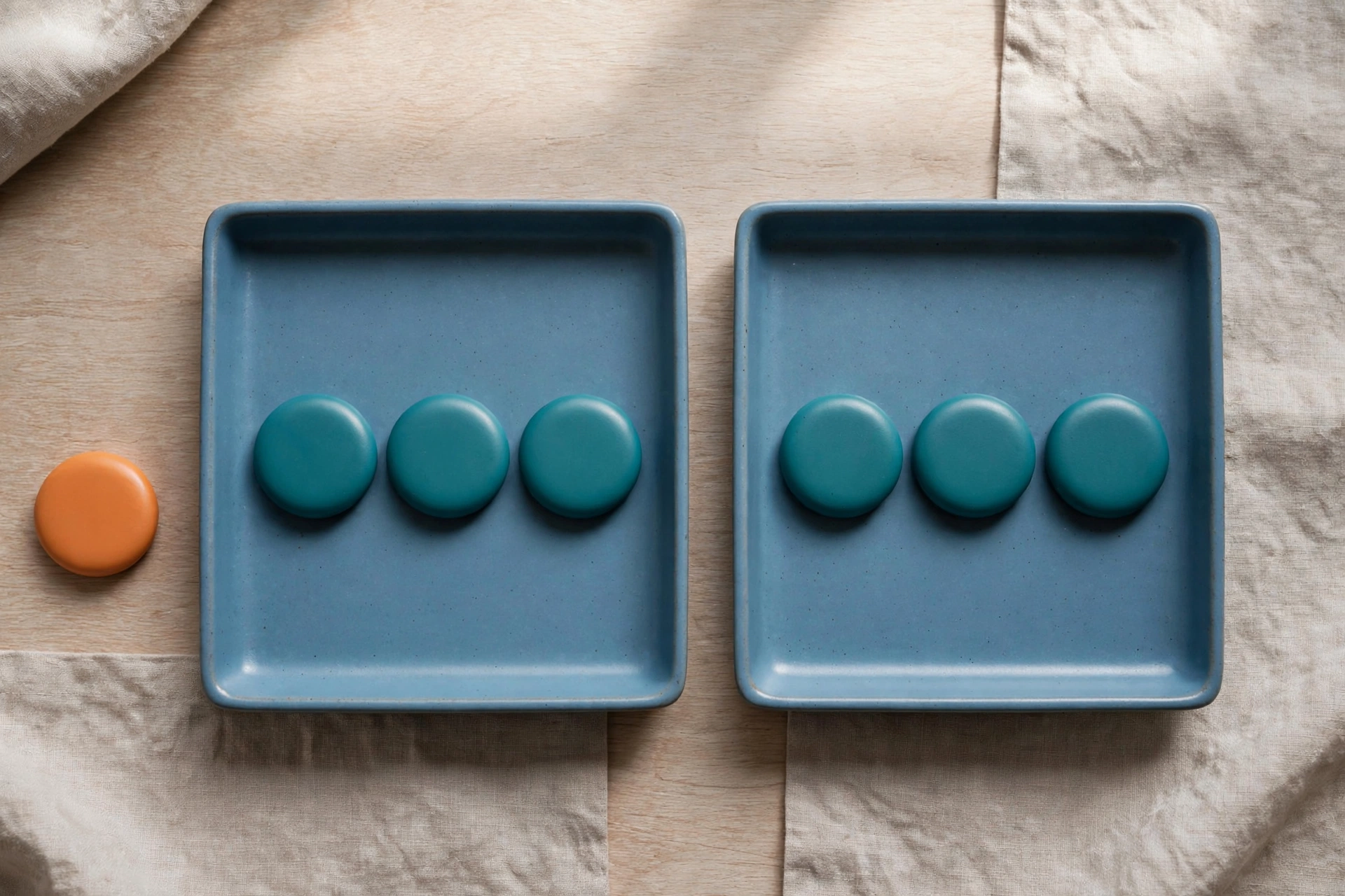Two blue trays hold teal tokens, with an orange token placed separately to represent an unbilled exception.