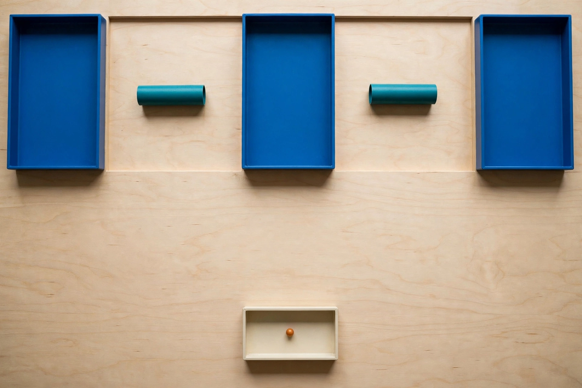Three blue rectangular trays are arranged horizontally with gaps between them, each containing a teal cylinder outside the tray.