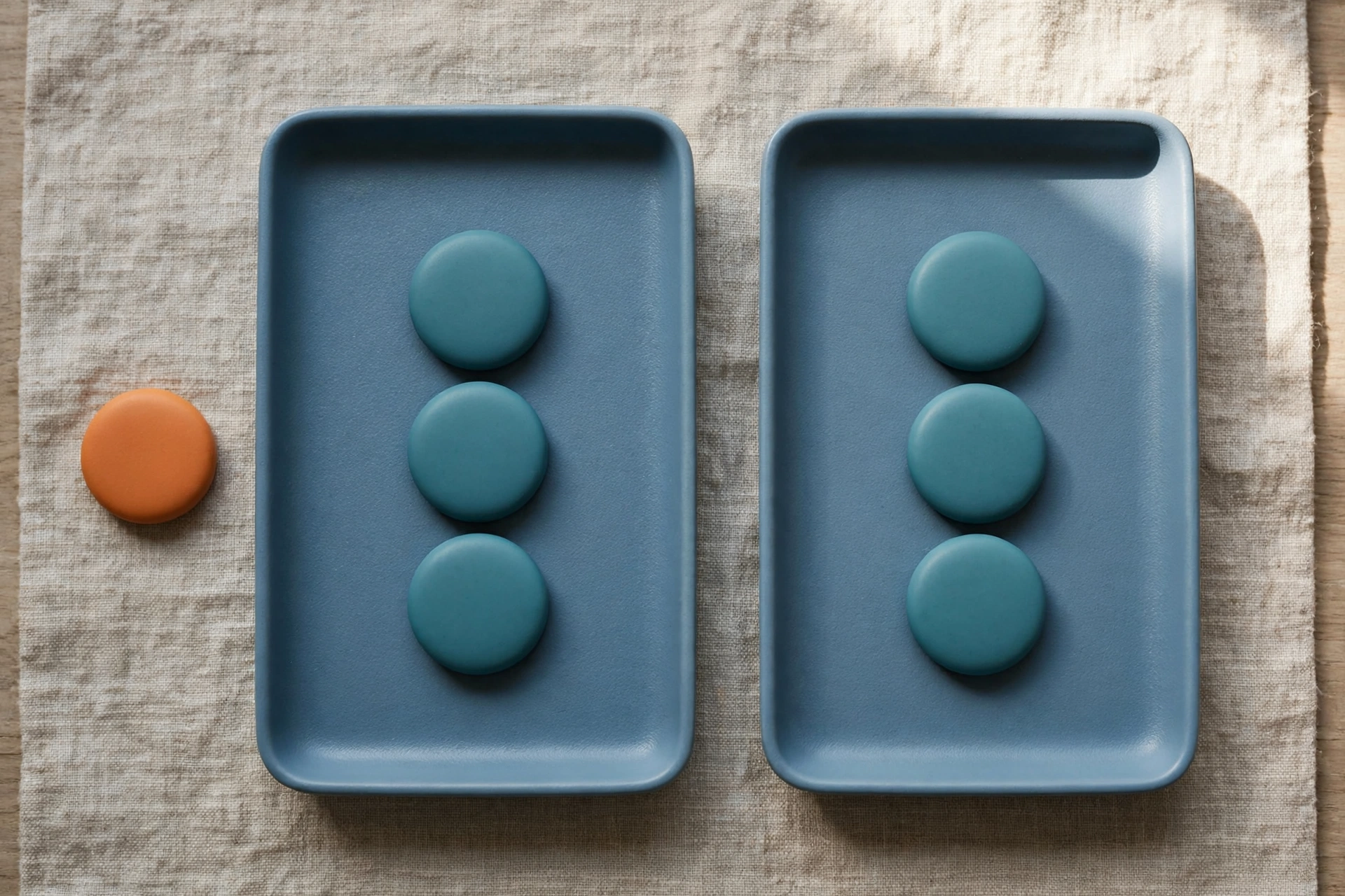 Two blue trays hold teal tokens, with an orange token placed separately to represent an unbilled exception.