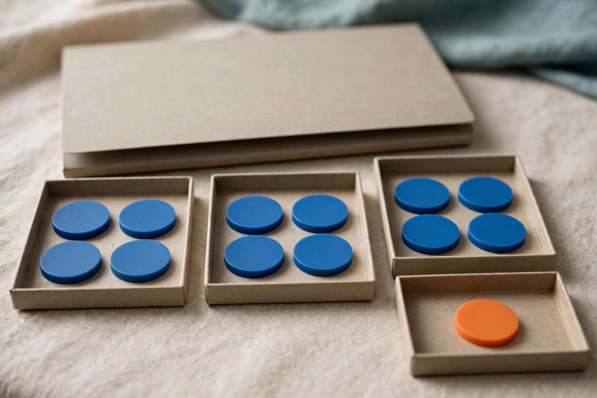Three office trays with blue tokens progress to a fourth tray with an orange token, with a closed folder behind.