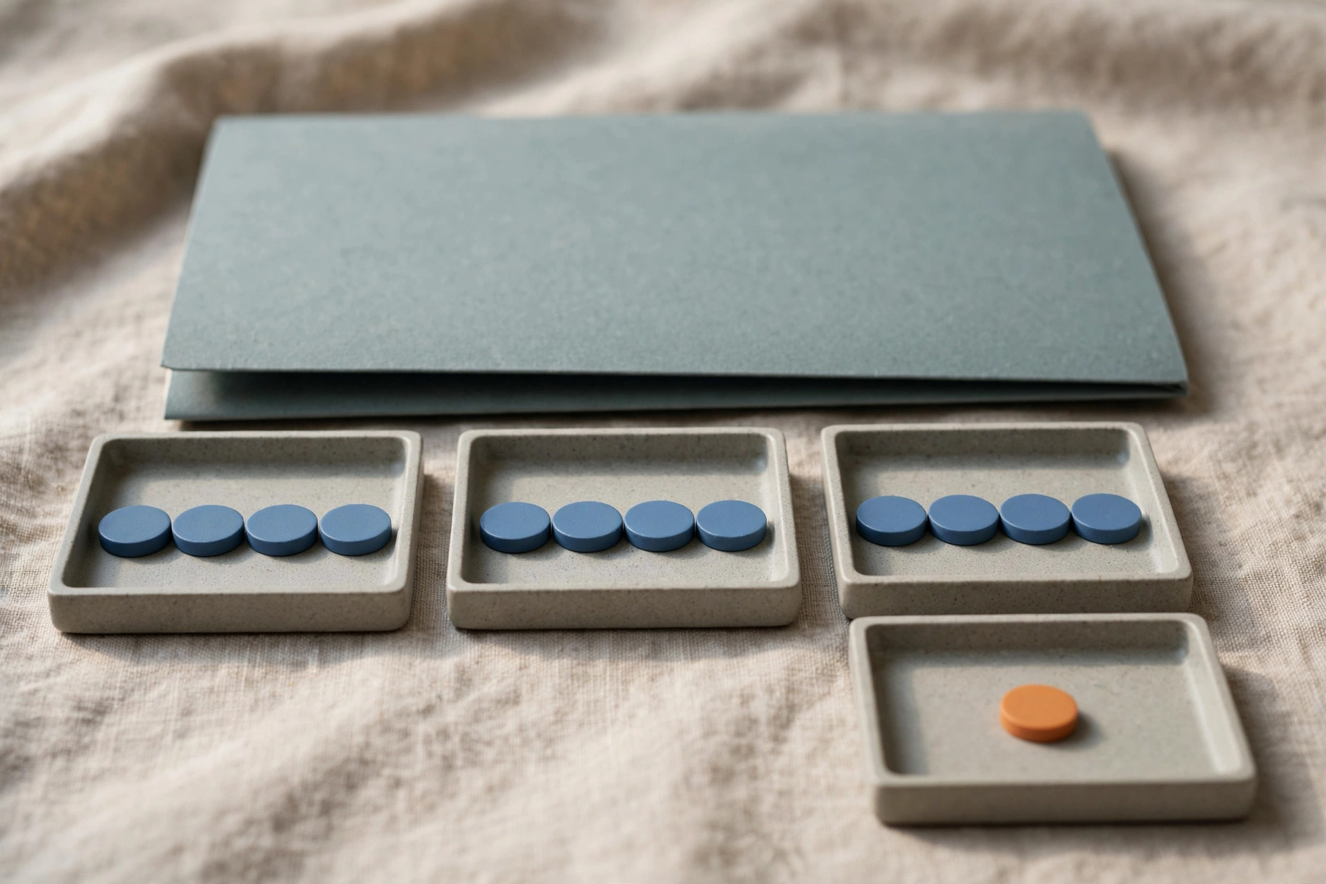 Three office trays with blue tokens progress to a fourth tray with an orange token, with a closed folder behind.